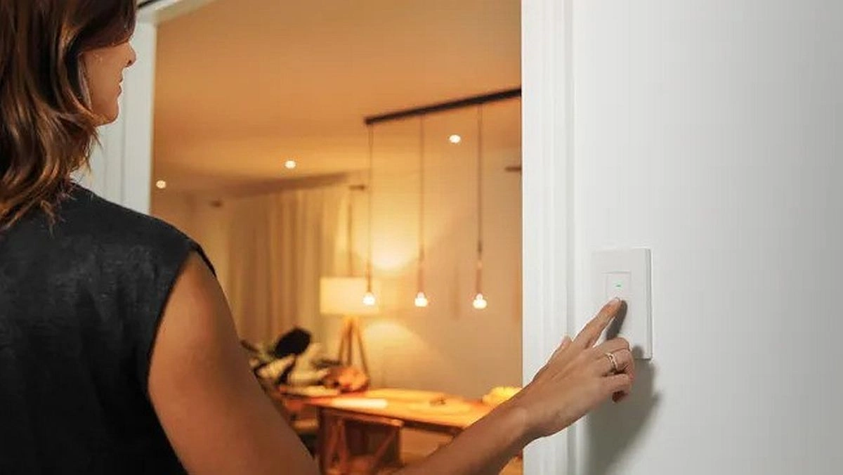 Eve smart light switch woman